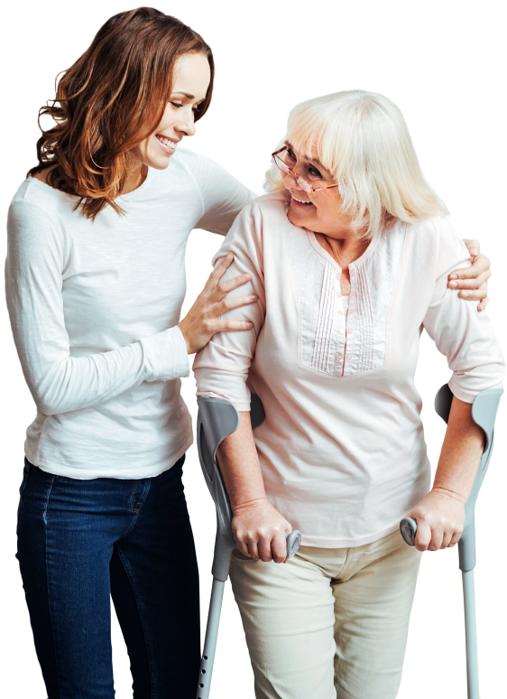 caregiver assisting senior woman to walk while smiling